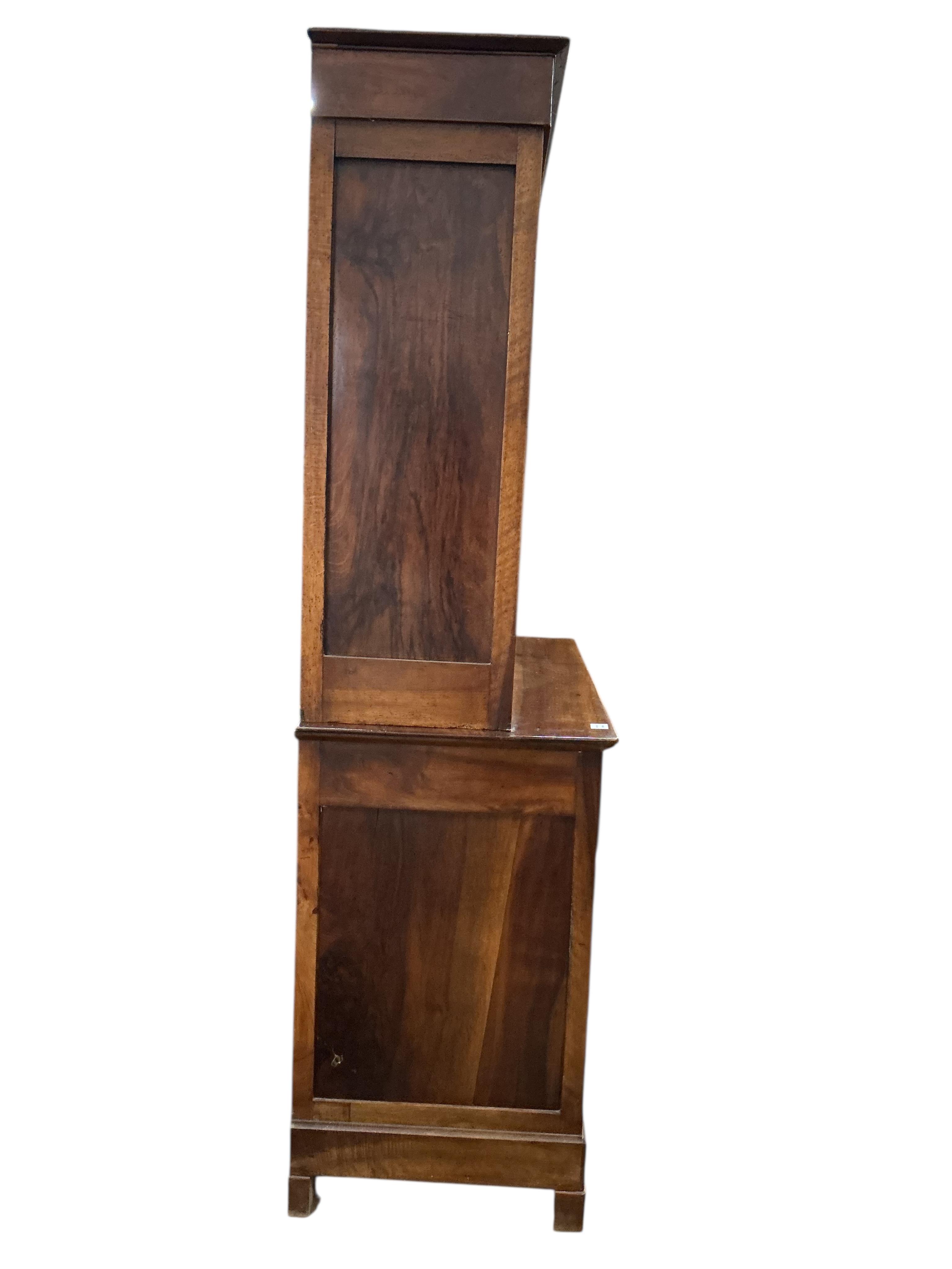 A 19th century French Biedermeier walnut side cabinet, width 125cm, depth 58cm, height 214cm